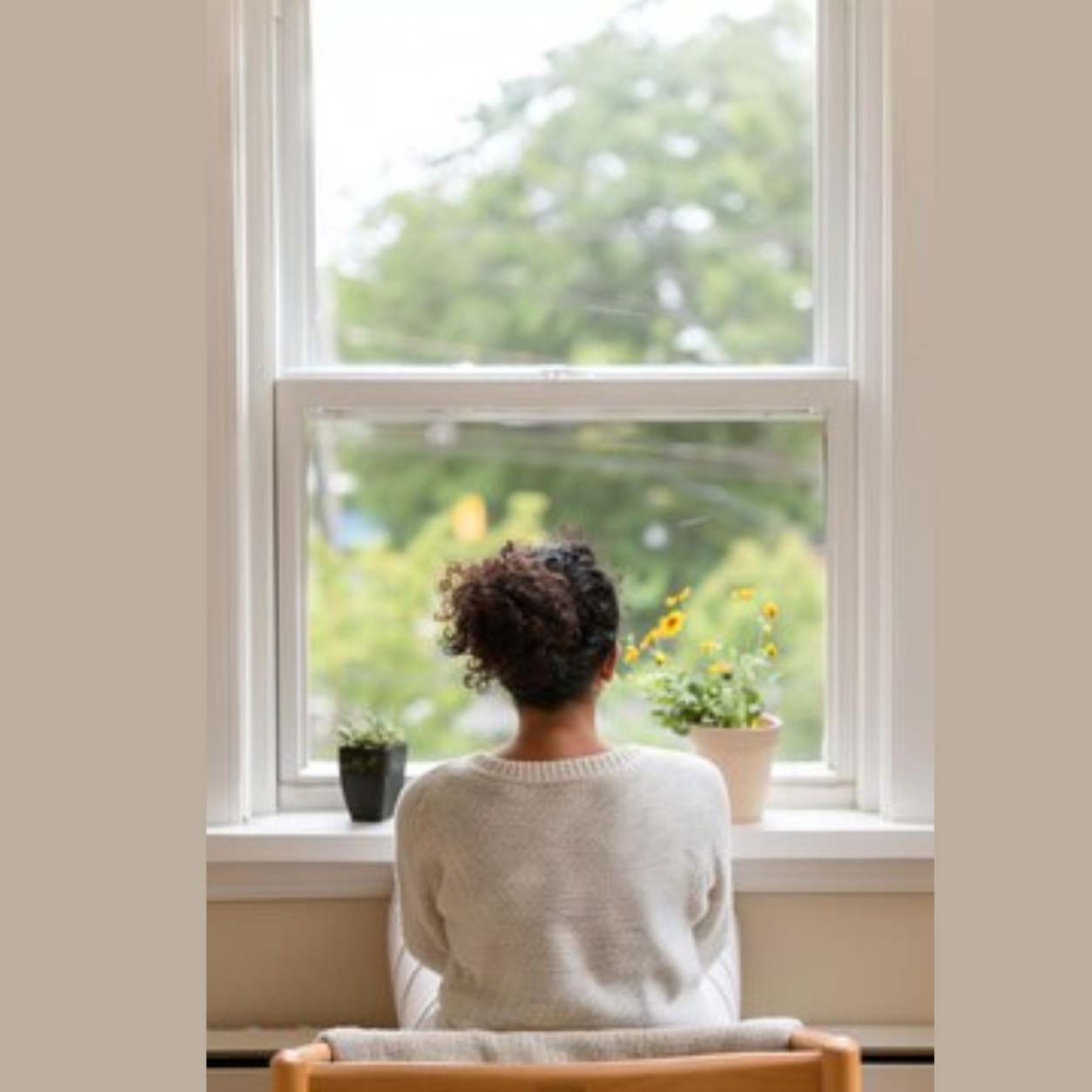 Woman sitting peacefully by a window looking at nature, symbolizing mindfulness, emotional balance, stress relief, and mental wellness.