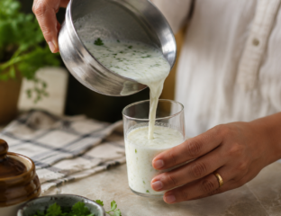 Bowl of curd beside a home-cooked plate of dal and vegetables, everyday foods that support how to improve gut health