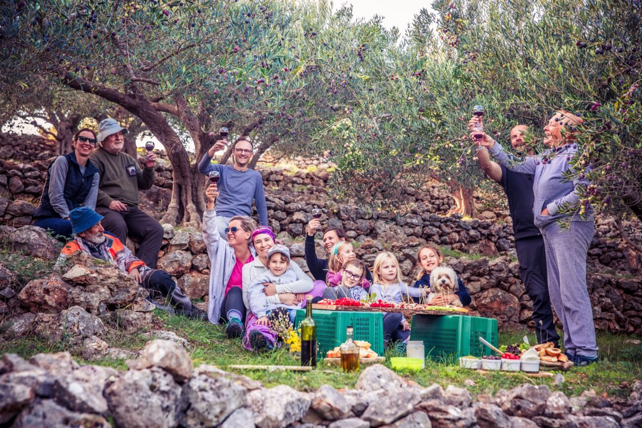 A multigenerational family walking together outdoors, reflecting thoughtful family trip planning