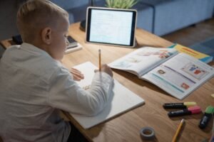 A student attending an online class with a teacher over video call, part of digital learning
